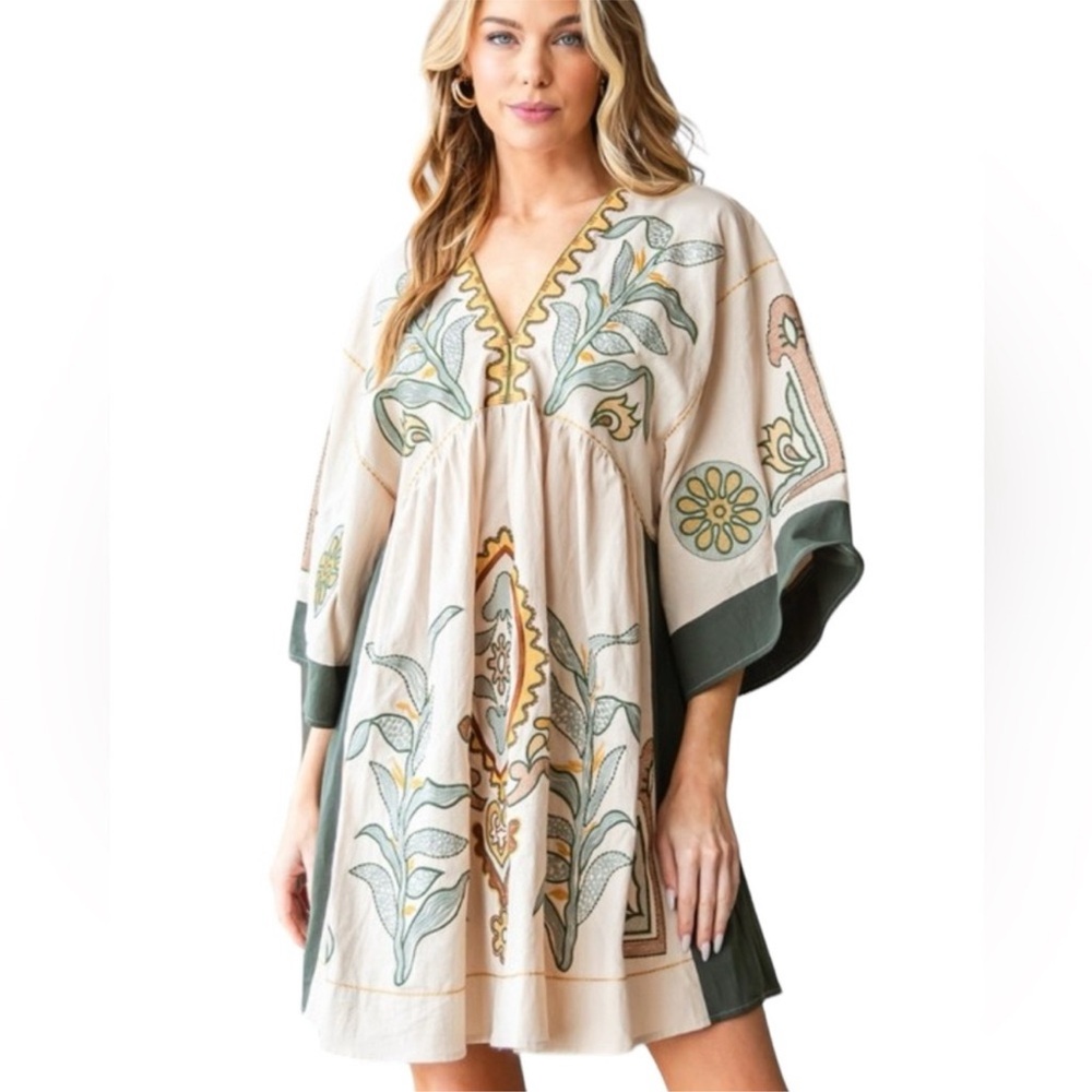 - 
Beautiful Embroidered Dress.  V neck.